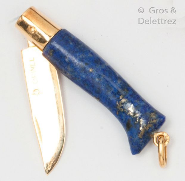 OPINEL Knife in yellow gold and lapis lazuli. The blade engraved and numbered. P&hellip;