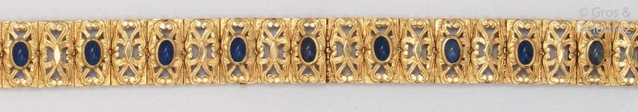 Null Supple yellow gold bracelet chiseled with interlacing, set with cabochon sa&hellip;