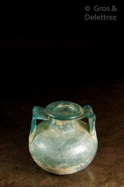 Null Two-handled globular funeral urn in translucent turquoise blue glass.

Rome&hellip;