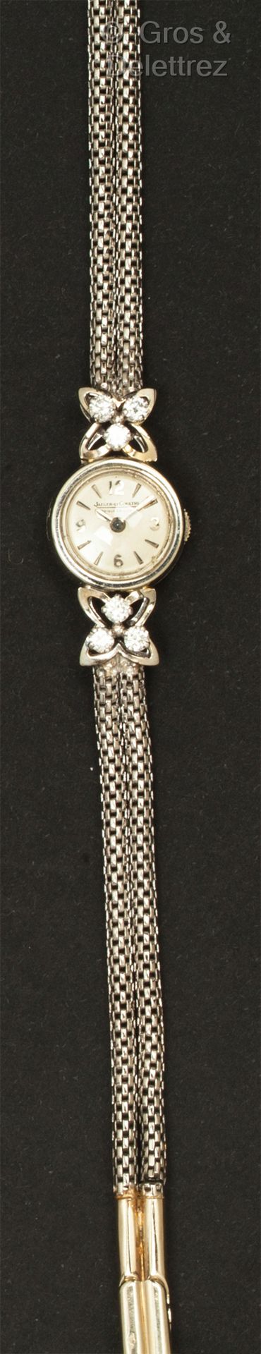 JAEGER LECOULTRE 白金女装腕表，圆形表壳（13毫米），白色表盘，镶嵌有四叶形图案的混合式时标，并镶有明亮式切割钻石。Duoplan运动。背面签署&hellip;