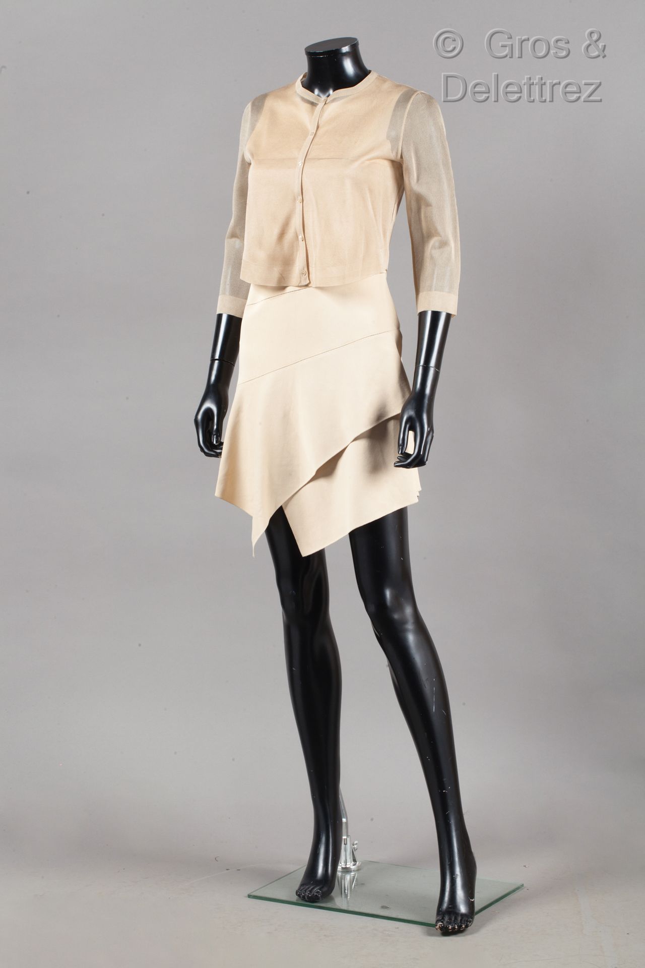 ALAÏA Sleeveless dress in nude knitwear, with an openwork bias pattern, bottom o&hellip;