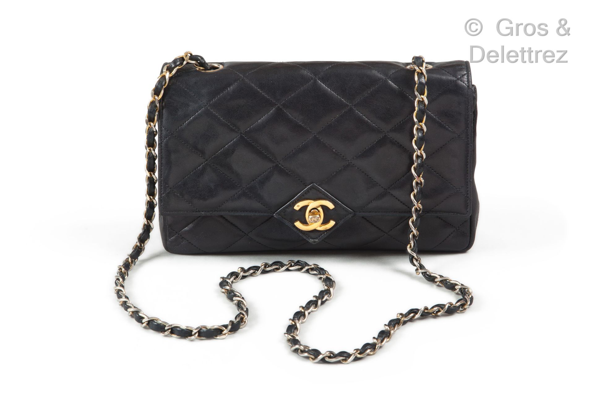 CHANEL par Karl LAGERFELD Circa 1987

Coco" bag 23 cm in black quilted lambskin &hellip;