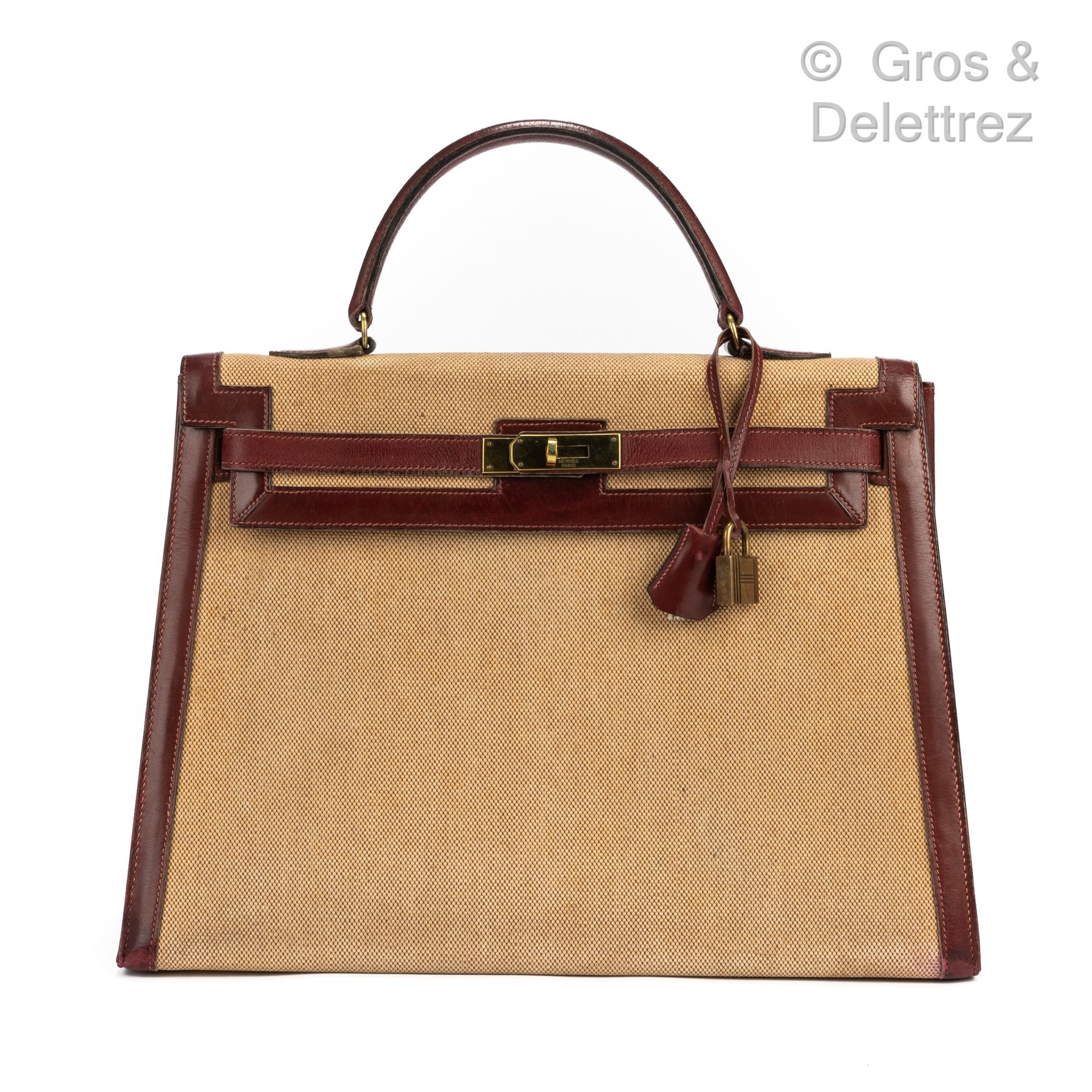 HERMES Paris Kelly Sellier" bag in beige canvas and burgundy leather box, gilt m&hellip;
