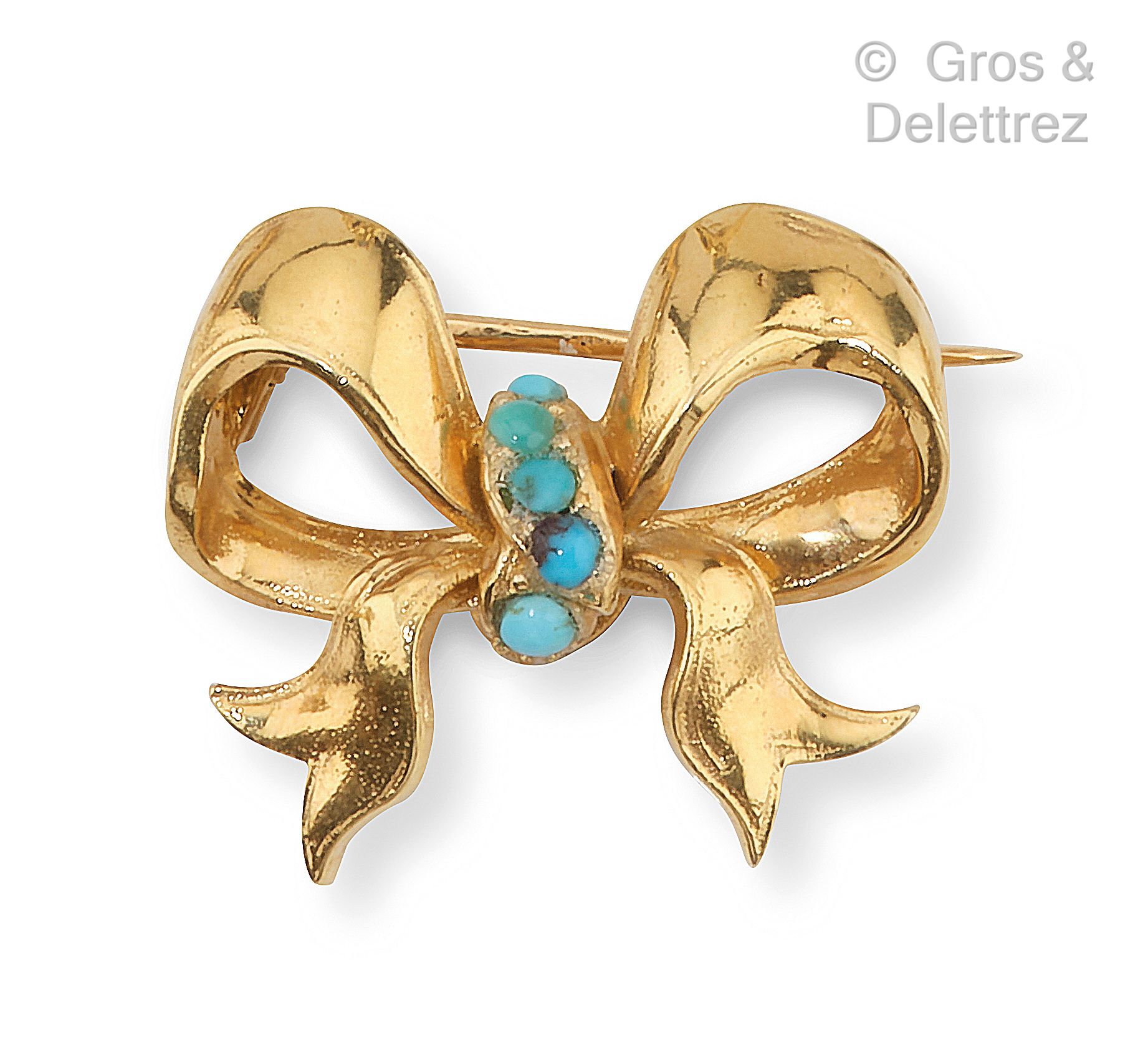 Null Brooch " Nœud " in yellow gold, decorated with turquoise. Length : 2,5 cm. &hellip;