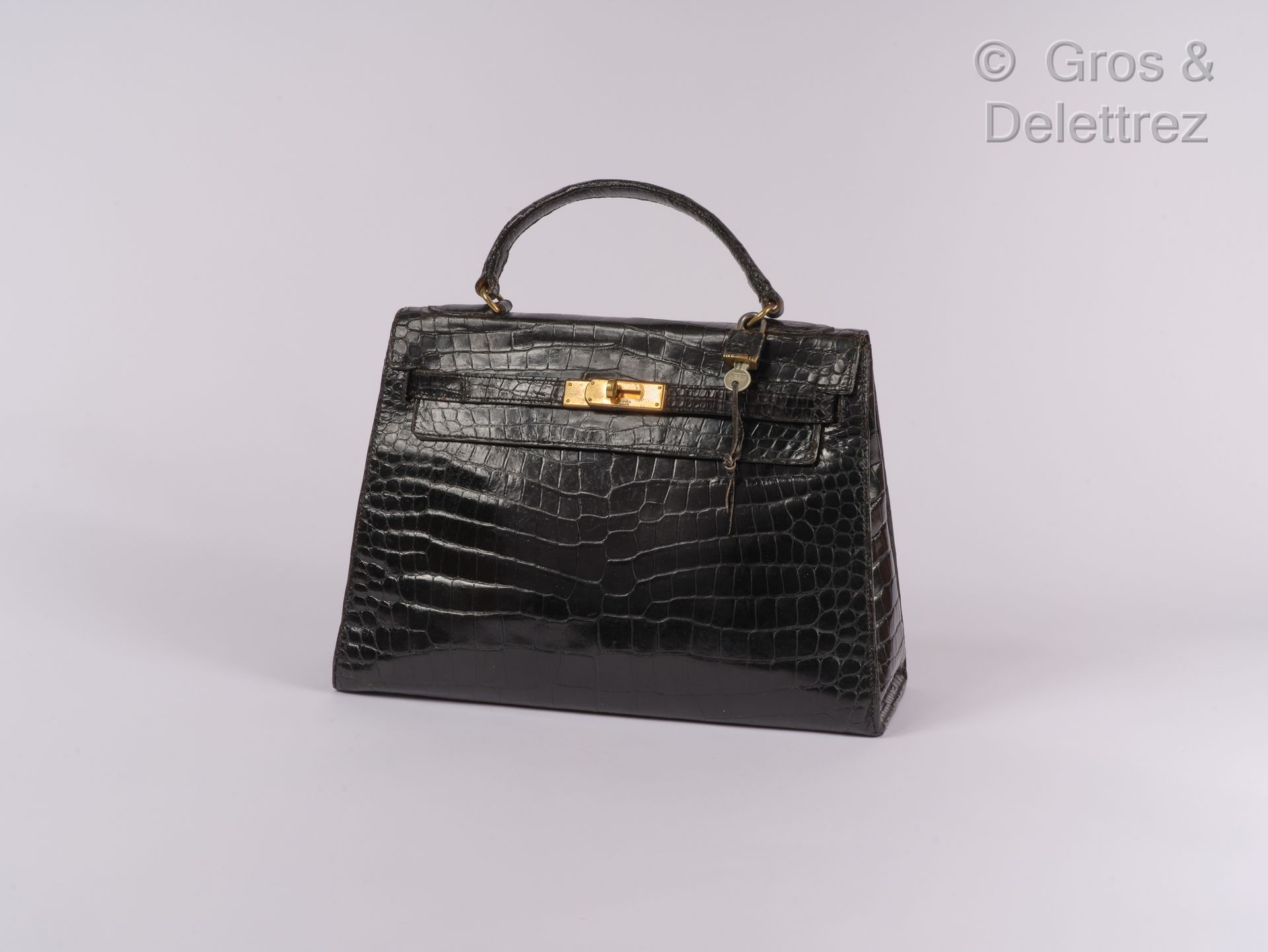 HERMES Paris ∆ "Kelly Sellier" bag in black crocodile, gold metal ties and clasp&hellip;