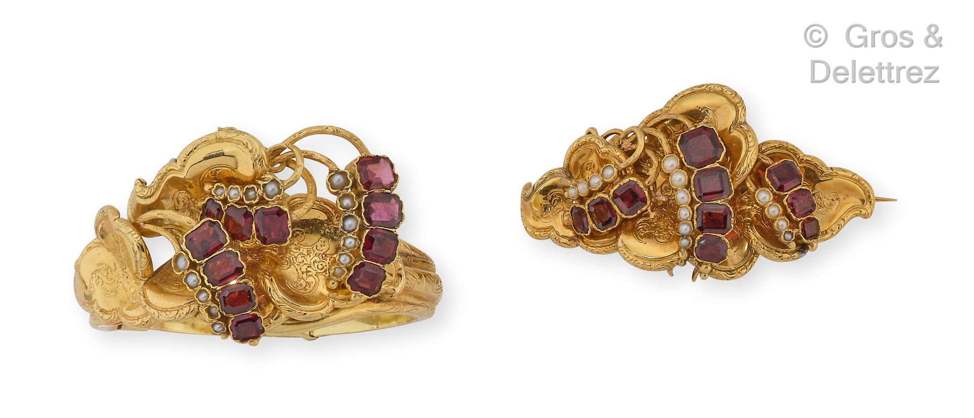 Null Yellow gold set consisting of a brooch and a bracelet decorated with garnet&hellip;