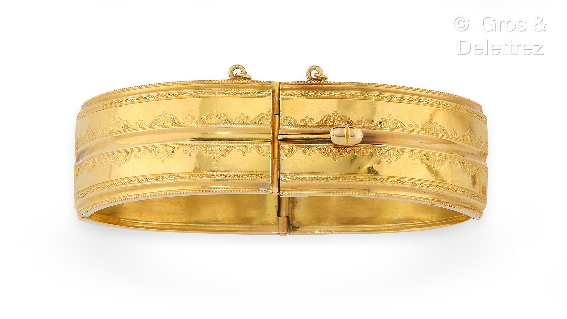 Null Semi-rigid bracelet in yellow gold, decorated with friezes of chased scroll&hellip;