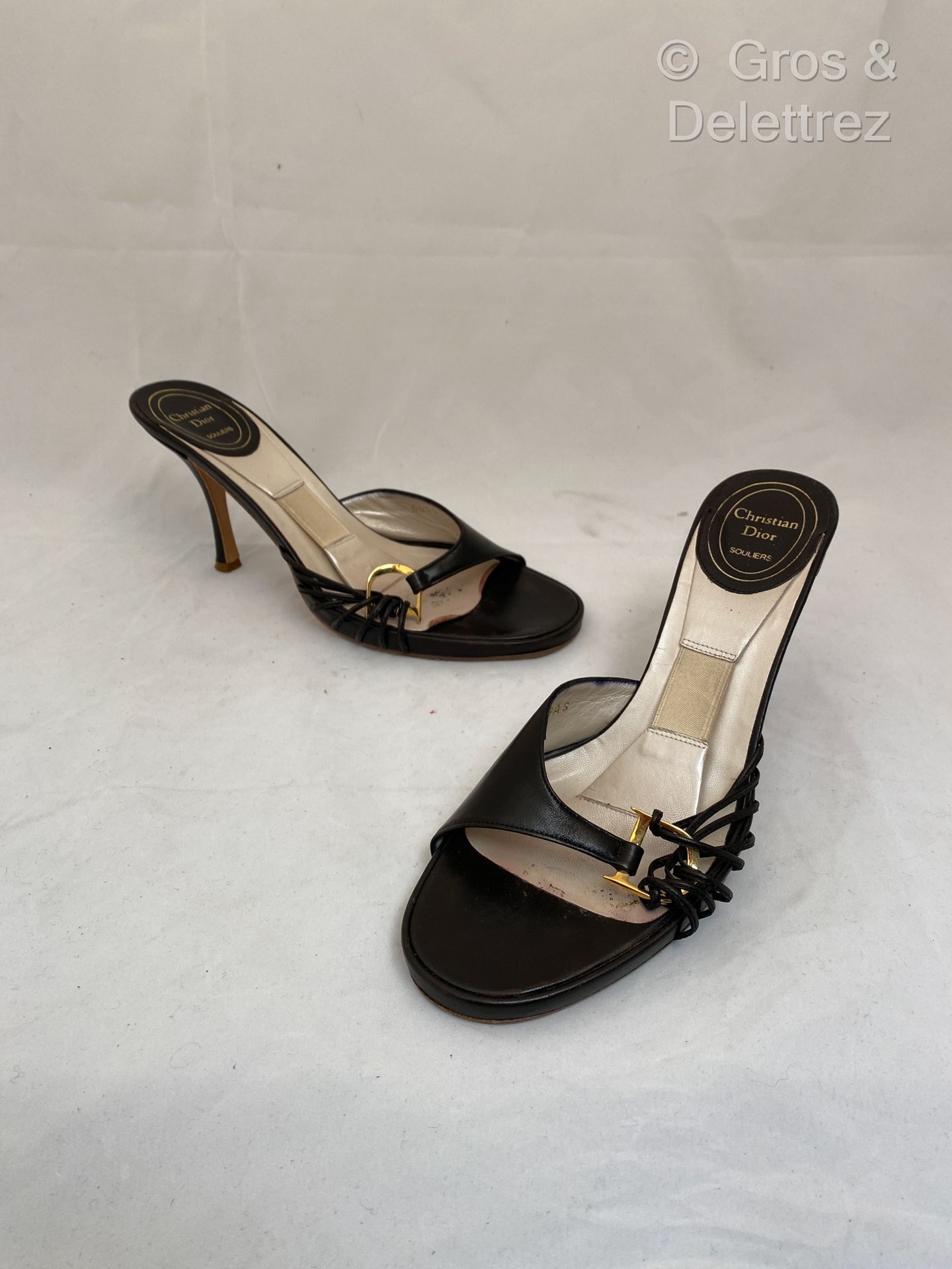 Null CHRISTIAN DIOR Pair of black leather heeled sandals, strappy uppers continu&hellip;