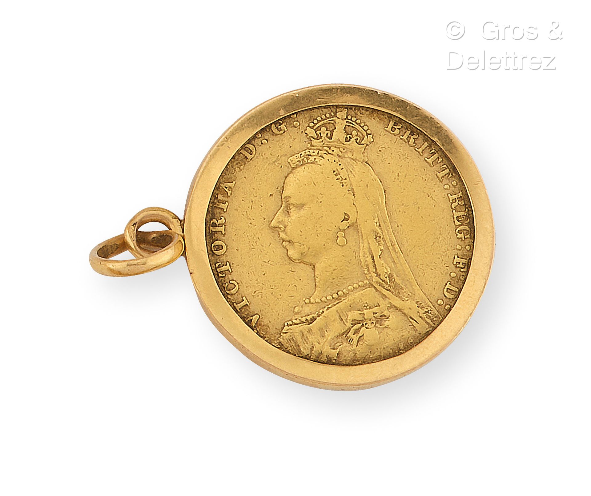 Null Medaglia in oro giallo 750 millesimi con in mano una moneta di una sterlina&hellip;