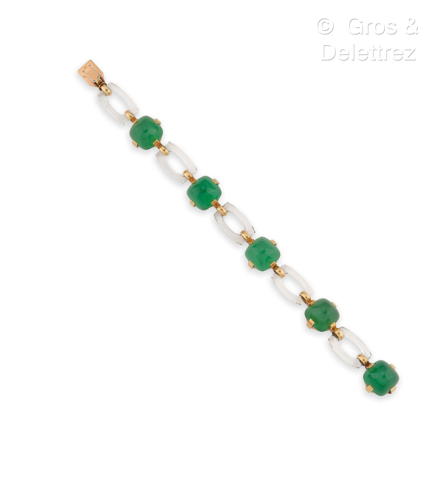 Null 20世纪40年代的法国作品--75万分之一黄金手链，由镶嵌着凸圆形绿宝石的圆形链节和穿插着岩石水晶的链节组成。手腕尺寸：18厘米。毛重：35.9克。