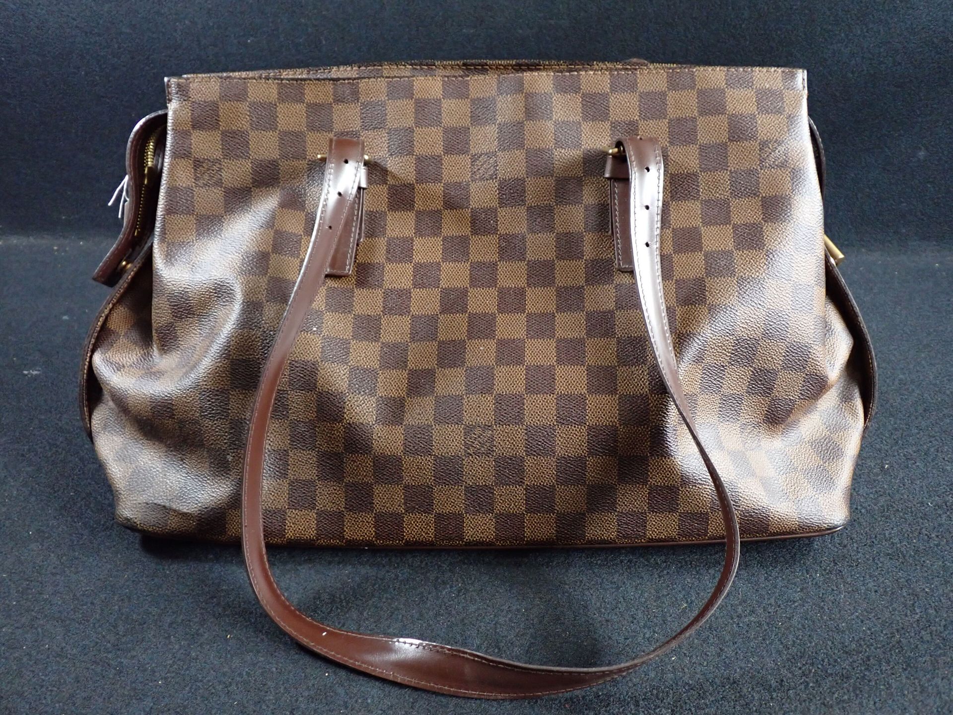 Null LOUIS VUITTON. A brown checkerboard canvas and brown leather bag, zipper cl&hellip;
