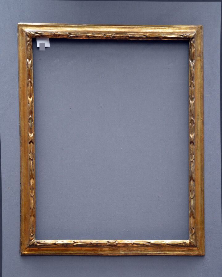 Null 一个模制的、雕刻的、镀金的、带有月桂树装饰的木框。

意大利，18世纪

92,5 x 72,5 x 7厘米