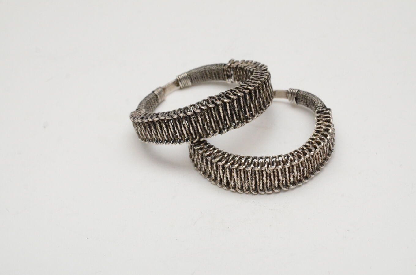 Null Pair of bracelets
twisted metal and a silver bracelet with scrolls.
Miao, G&hellip;