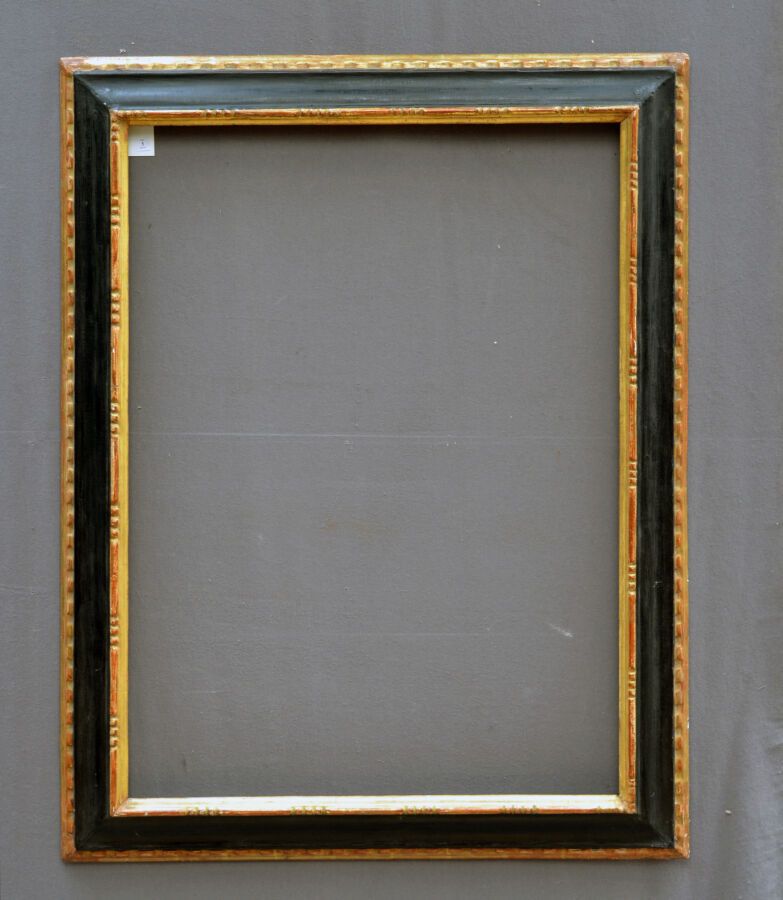 Null A molded, carved, blackened and gilded wooden frame with a frieze of rosari&hellip;