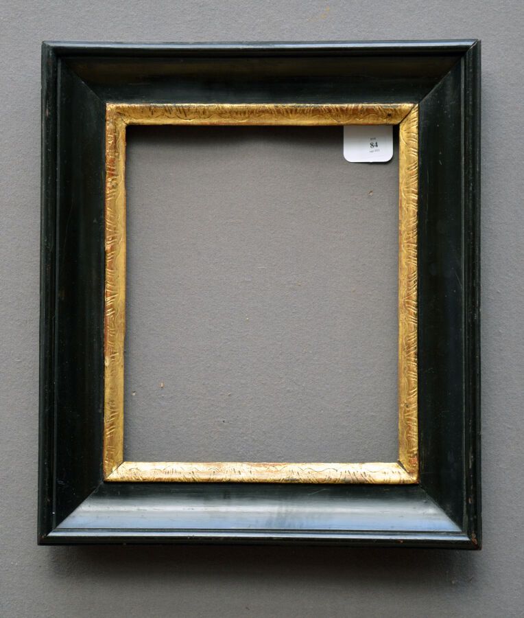 Null Frame in molded wood, blackened and gilded, with water leaves.

Italy 18th &hellip;