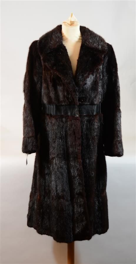 Null Long brown mink coat by M. Litrine with black leather belt.