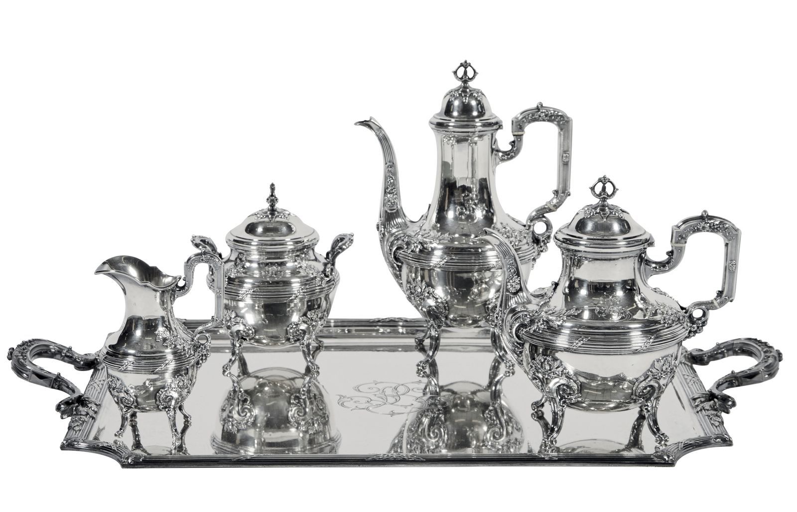 Null 3-银质茶具和咖啡具，包括咖啡壶、茶壶、牛奶壶、有盖糖碗和托盘，上面有丰富的叶子和卷轴装饰。

标记的Minerve

毛重：7213克