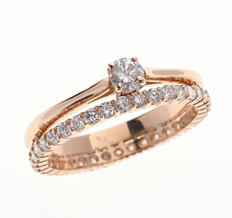 Null BAGUE "solitaire" en or rose 750/°° formée de deux anneaux reliés, l'un ent&hellip;