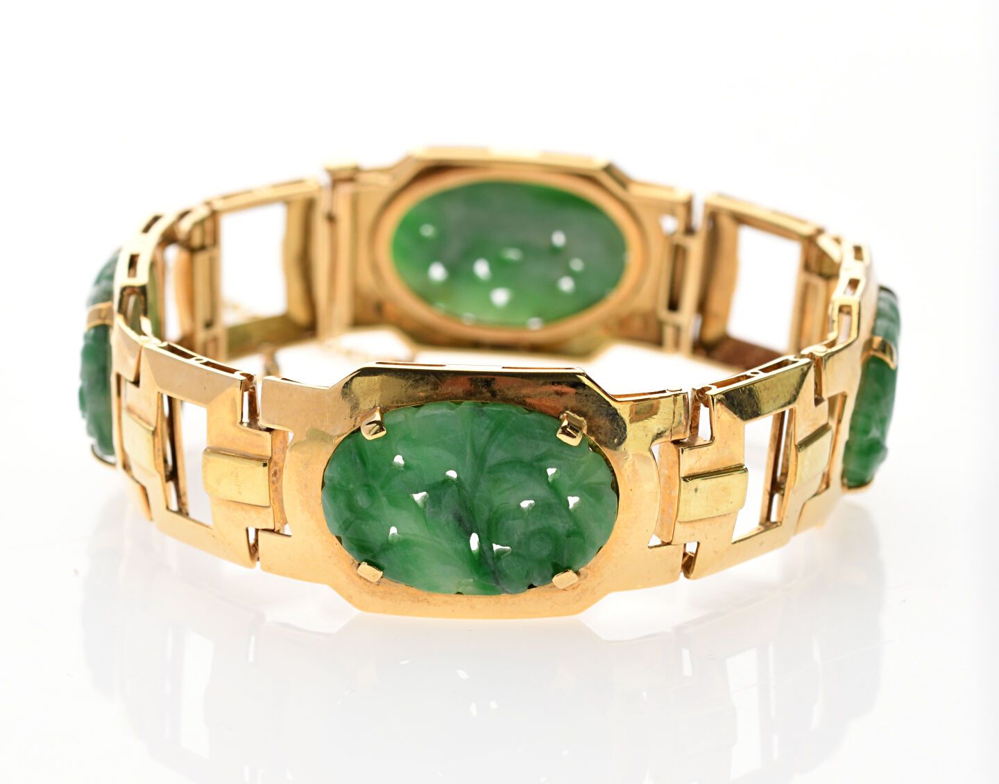 Null BRACELET in yellow gold 750/°° openwork decorated with four oval jade plate&hellip;