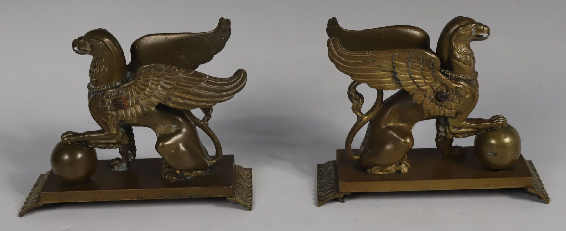 Null Pair of subjects in patinated bronze representing griffins sitting with the&hellip;