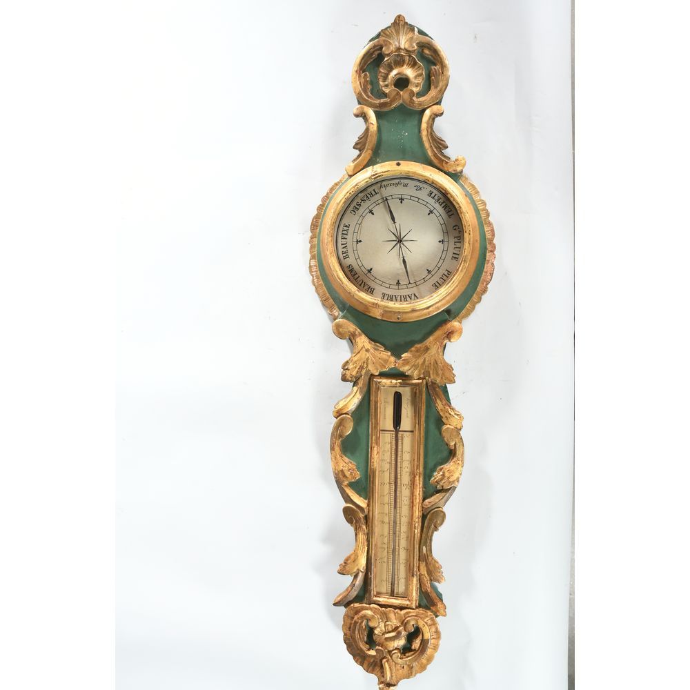 Null 一个路易十五时期的鎏金木制气压计和温度计，上面装饰着贝壳和花环。(缺少后面的水银管和玻璃）。十八世纪。H.96 L.27.
