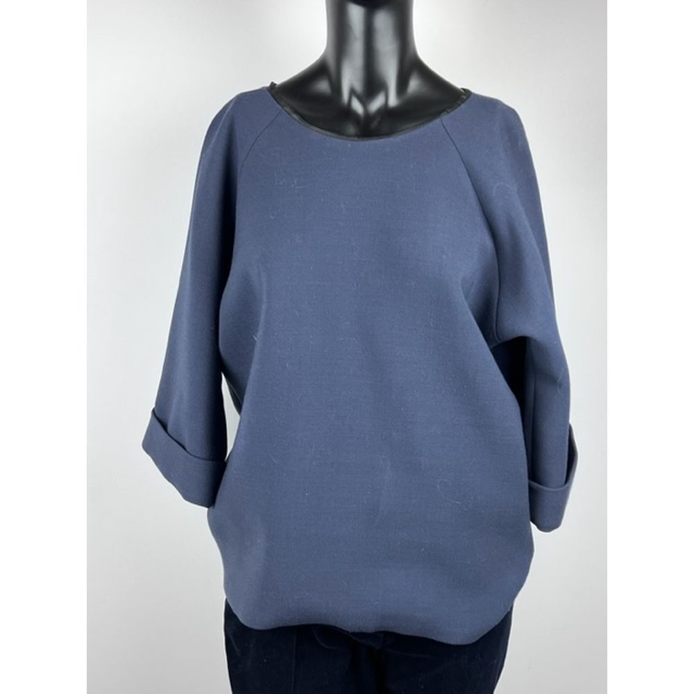 Null MUSSO Milano. Flared tunic in blue virgin wool. Round neckline tying in the&hellip;