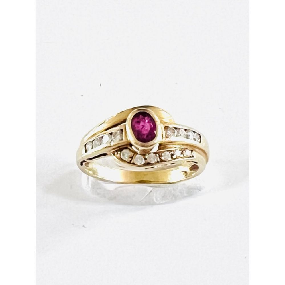 Null Yellow gold ring set with an oval ruby and two lines of diamonds. TDD.56. P&hellip;