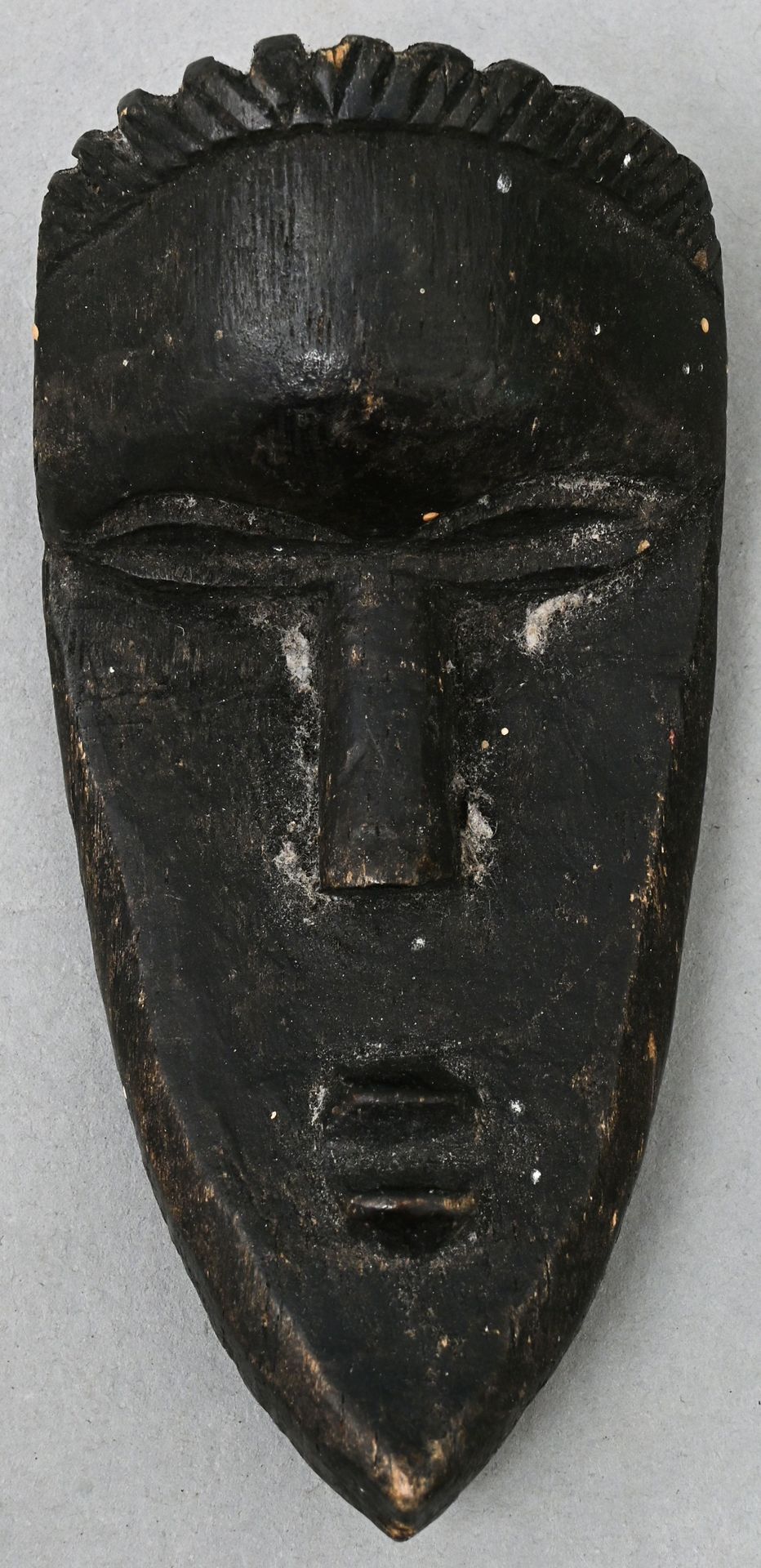 Null Miniature mask in the style Bassa (Liberia) wood, carved, blackened. One an&hellip;