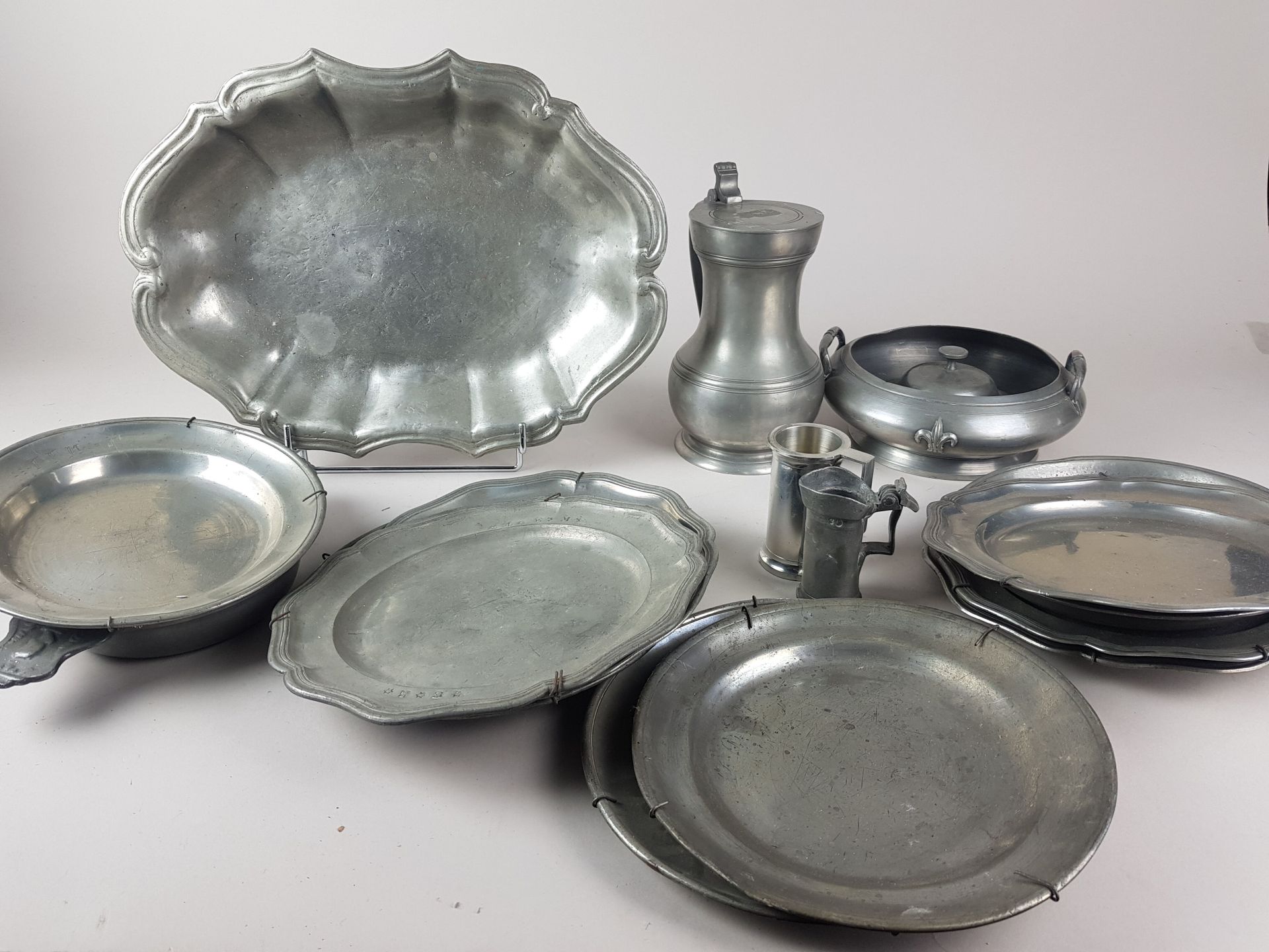 Null LOT of pewter including a pitcher, plates, dish and various - wear of use