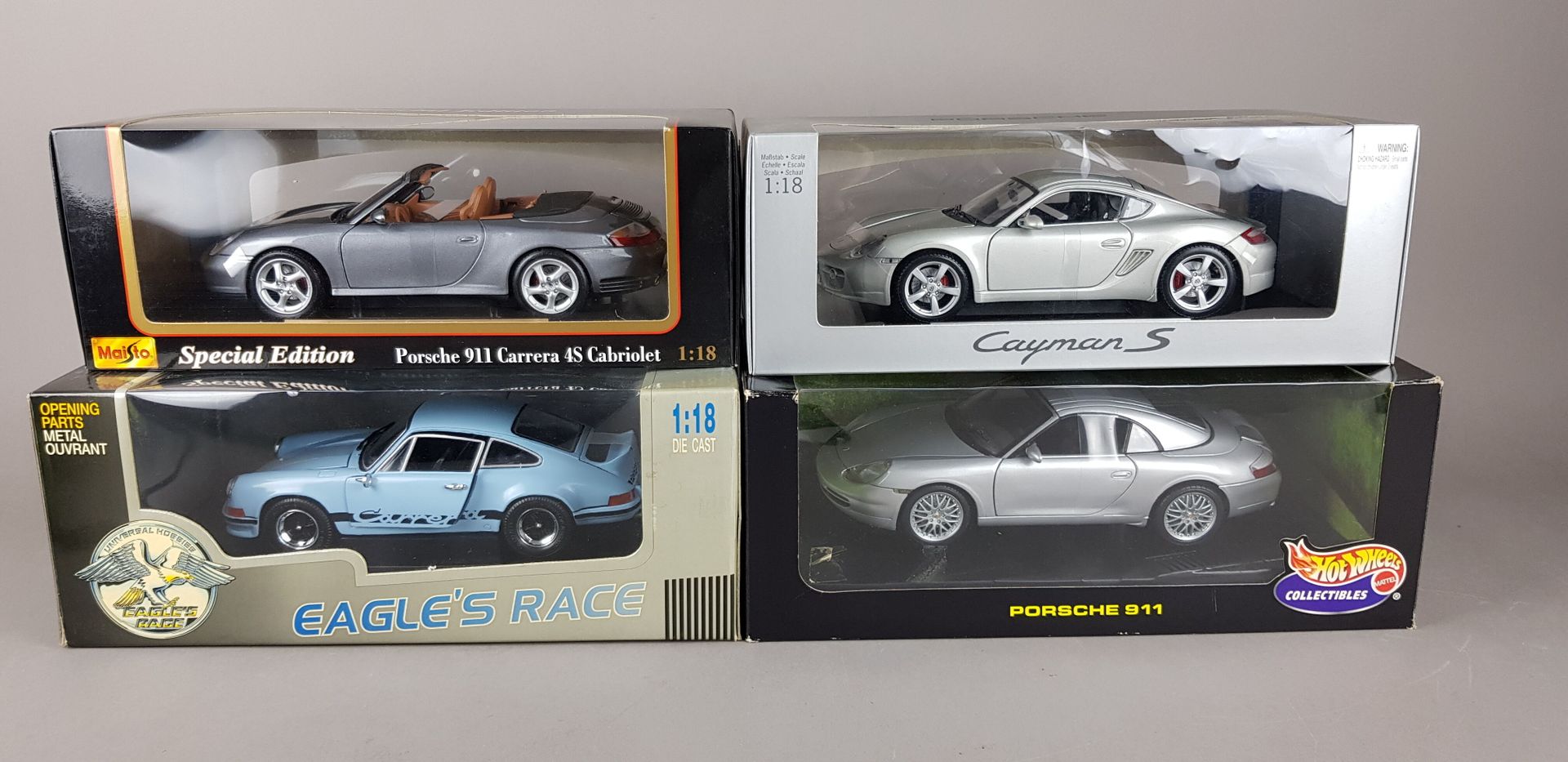 Null QUATRE PORSCHE échelle 1/18 :

1x Die-Cast Eagle's Race

1x Maisto 911 Carr&hellip;