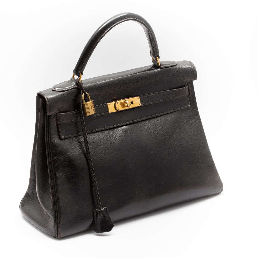 Null HERMES Paris Kelly

Tasche 33cm in schwarzer Box, Schlüssel mit Vorhängesch&hellip;