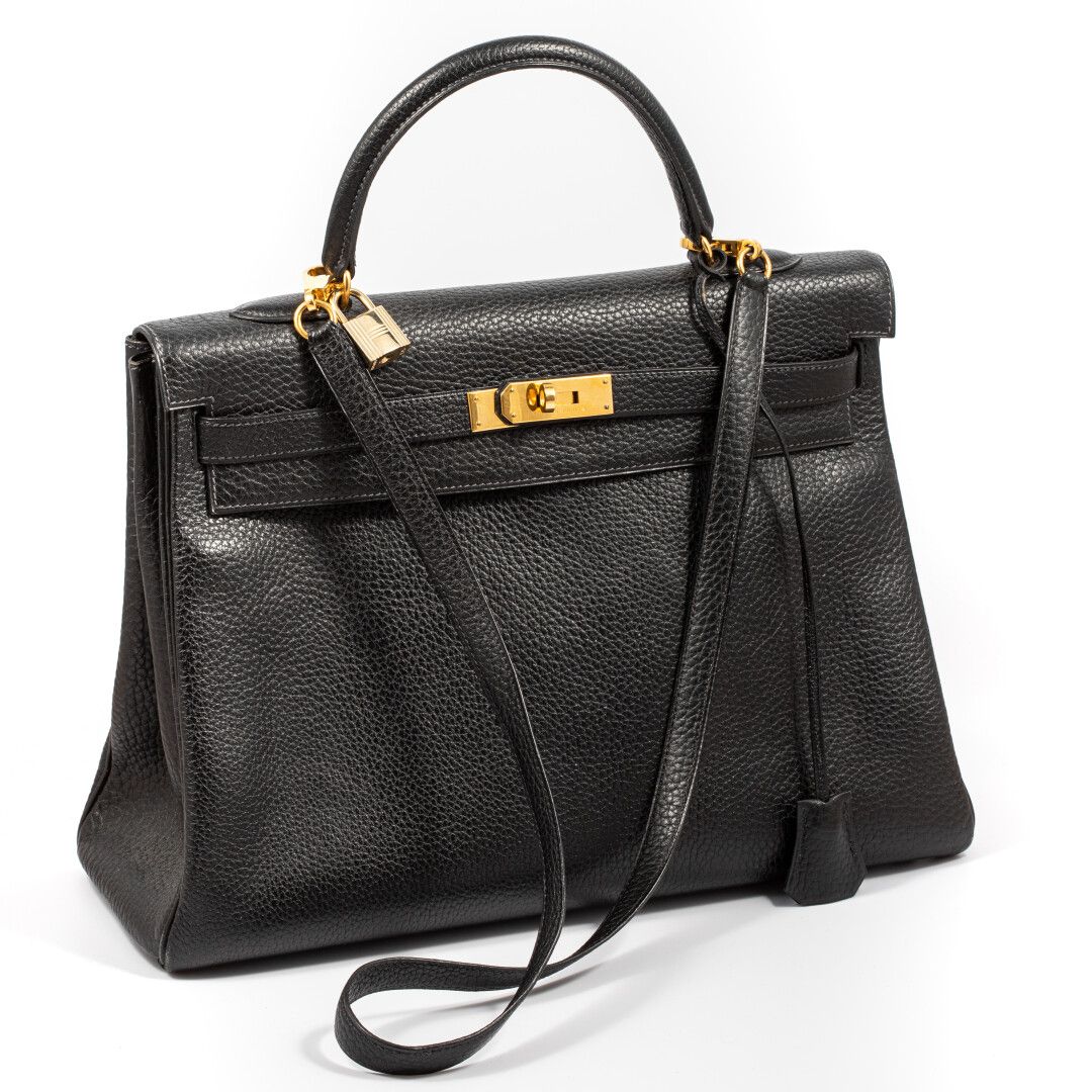 Null HERMES Paris "Kelly 

32cm bag in black taurillon leather and gold metal lo&hellip;