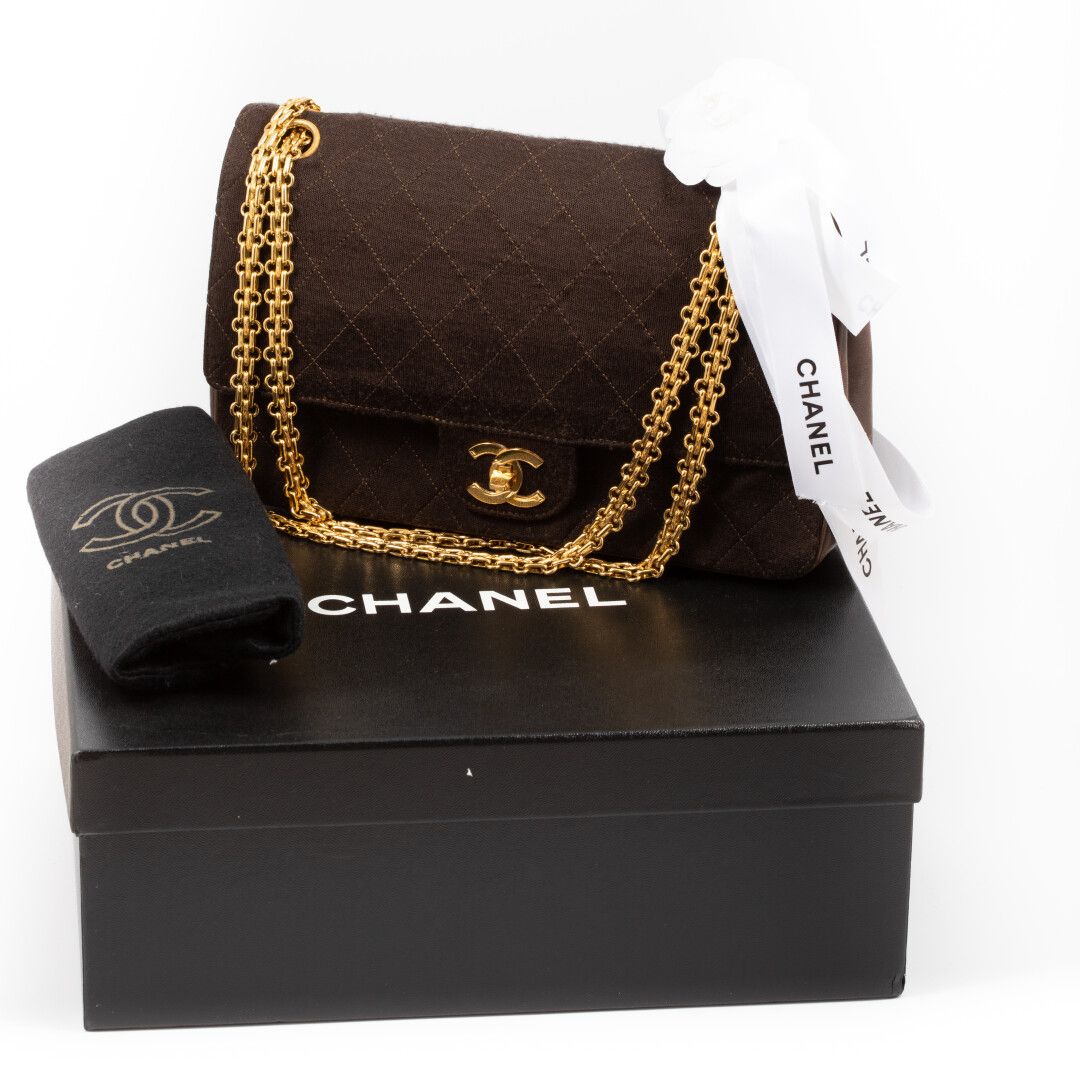 Null CHANEL - "2:55" 

Quilted jersey and chocolate leather bag, gold metal trim&hellip;