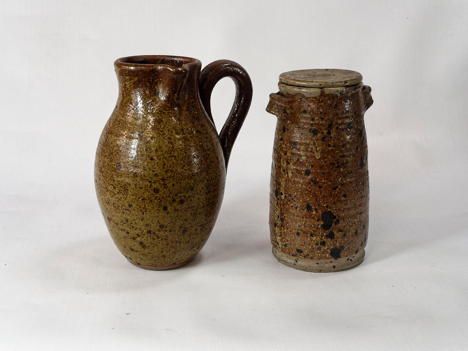 Null Set of stoneware including a jug (height: 21.5) and a covered pot (height: &hellip;