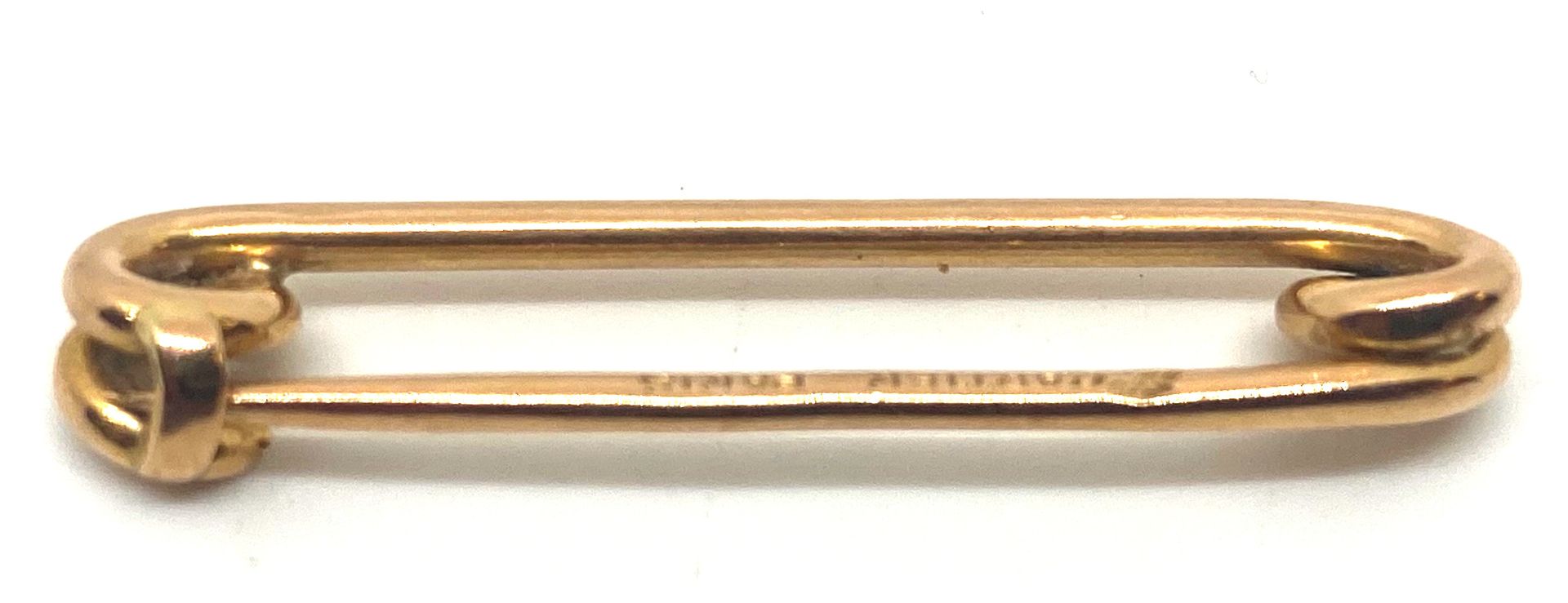 Null CARTIER, safety pin in yellow gold 750/1000, 18 carats, weight : 3,14 g