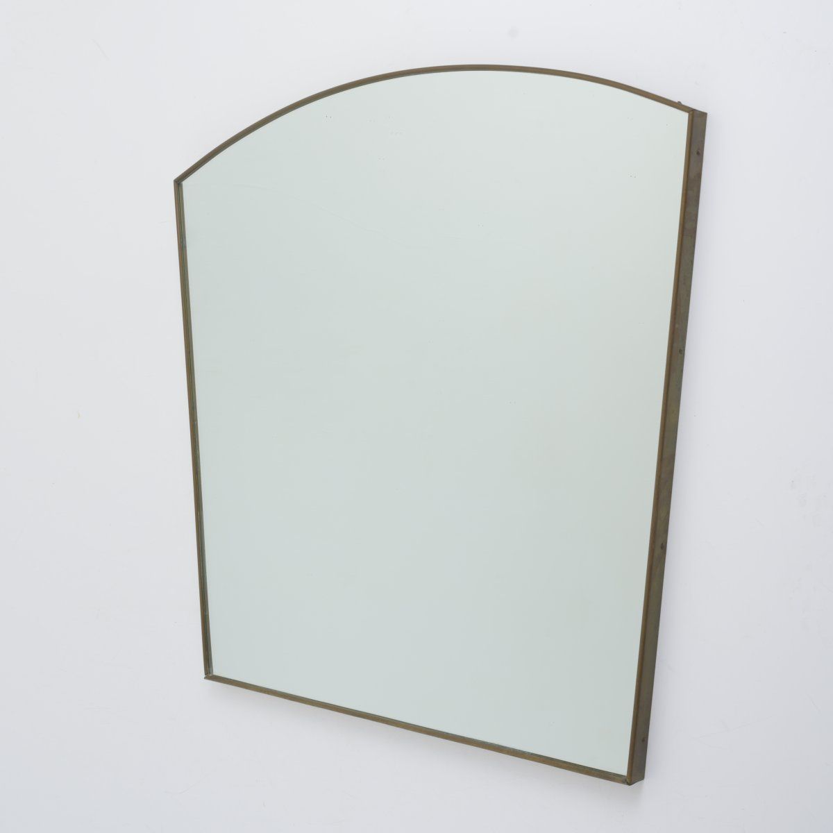 Null Italy, Large wall mirror, c. 1949, H. 85 x 95.5 x 3 cm. Sheet brass, wood, &hellip;