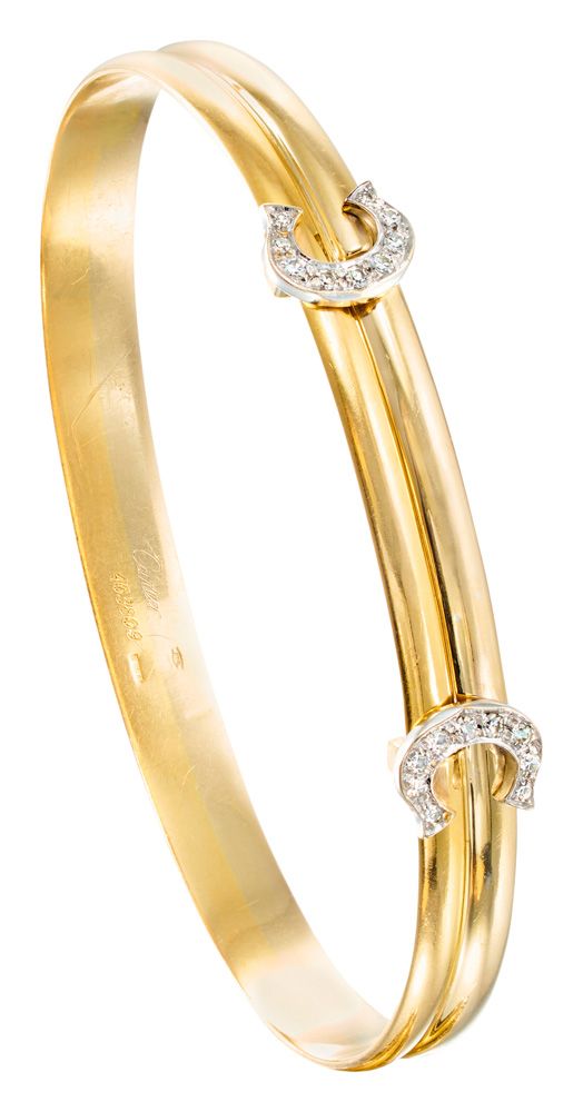 CARTIER 双色金 "双C "滑动手链，C字头镶有8/8钻石

有签名和编号的

D：6.2厘米

重量：18.95克（18K-750/1000）。

伴随&hellip;