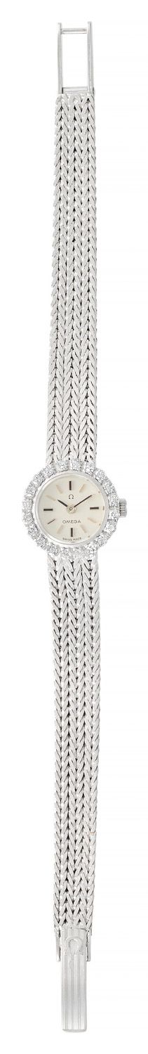 OMEGA Lady's watch in white gold, bezel set with 8/8 diamonds, grey background, &hellip;