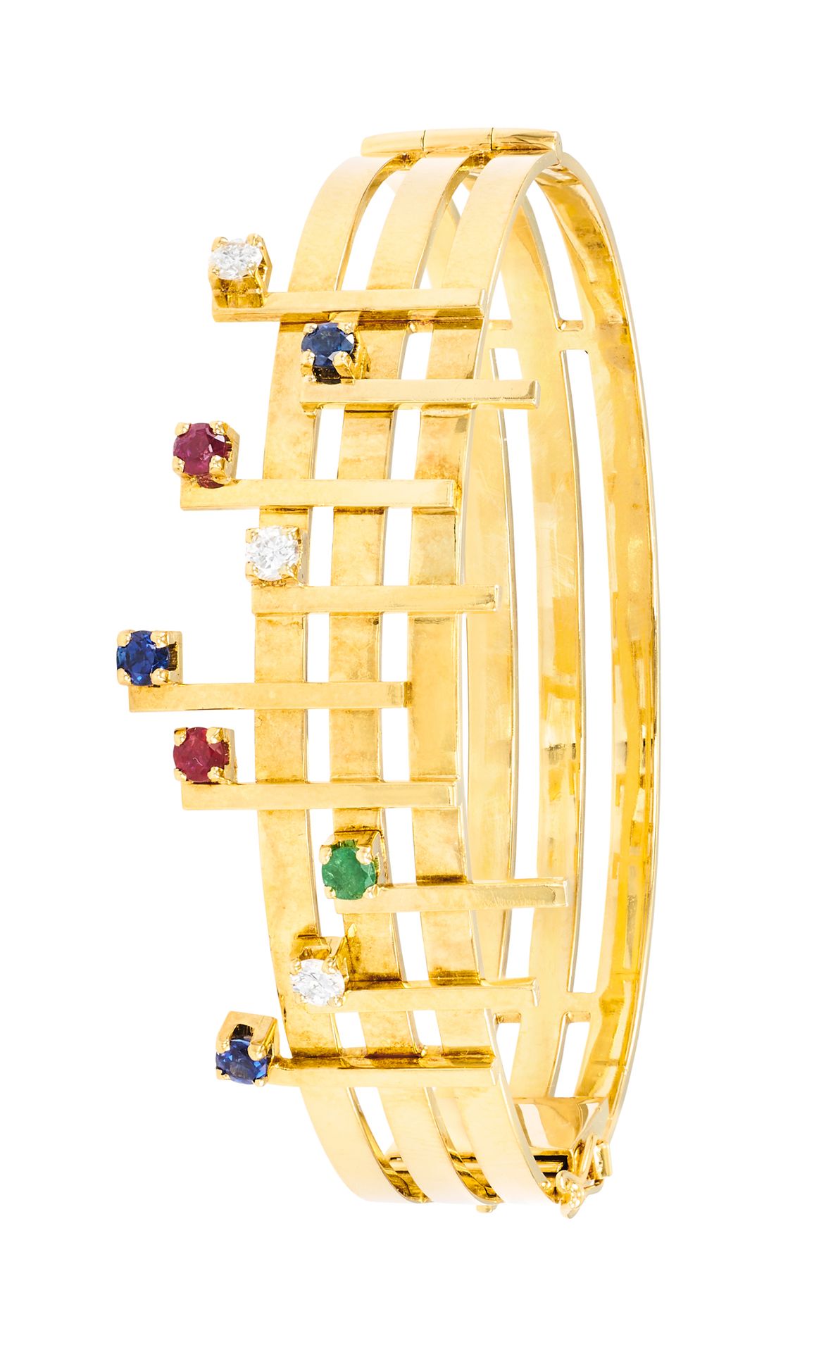 Bracelet ovalisé 侧面开口饰有乐谱，黄金材质，点缀蓝宝石、红宝石、祖母绿和明亮式切割钻石
法国作品
直径：5.6 厘米 - 宽：1.3 厘米
重&hellip;
