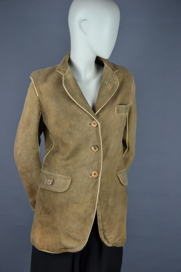 Null ALAIA Paris

Lange hellbraune Jacke mit beigem Streifen aus Leder im Tirole&hellip;