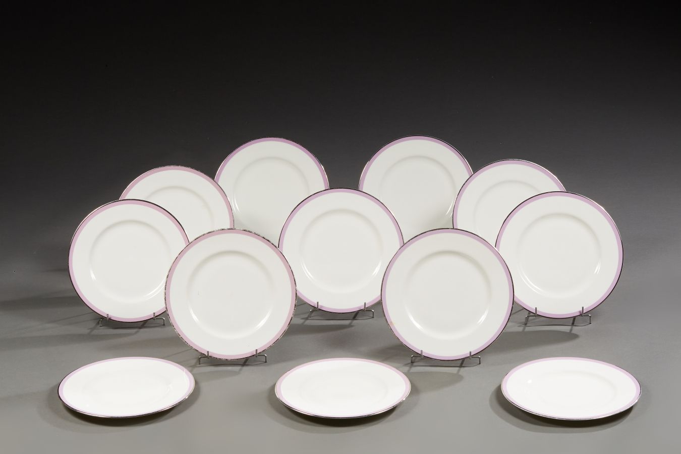 Null 
Dibbern. Twelve round dessert plates in white porcelain. The marli underli&hellip;