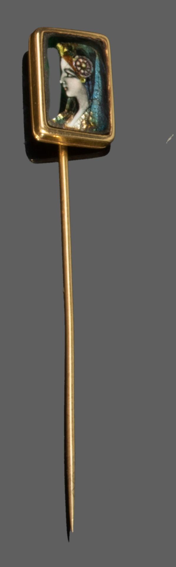 Null 52.750千分之一黄金雕刻笔，饰有利摩日珐琅图案。

毛重 : 3,6 g