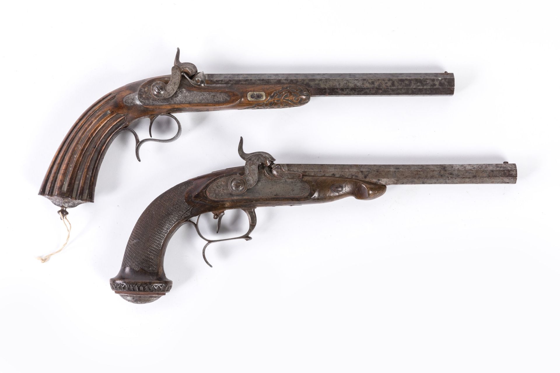 Null Two percussion pistols: 

- Officer's pistol. Ribbed barrel. Iron fittings &hellip;