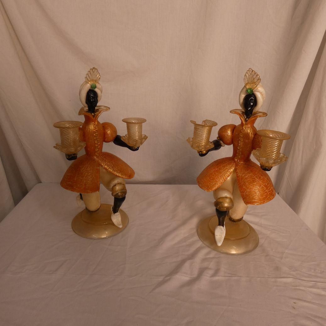 Null 
	 Pair of candlesticks 2 candles, in coloured glass, one broken. 
	
Sold a&hellip;