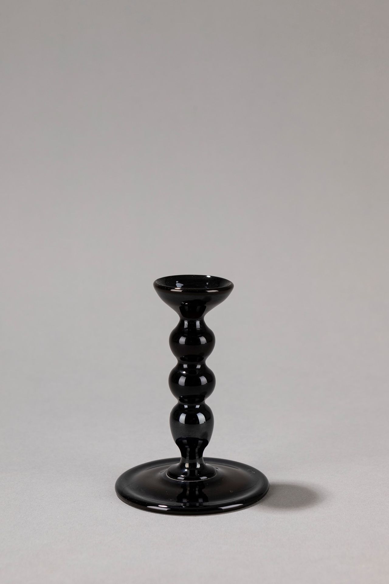 VENINI Candle holder, 1960 ca.

H 11 x 8 cm 
black blown glass.

Engraved sign V&hellip;