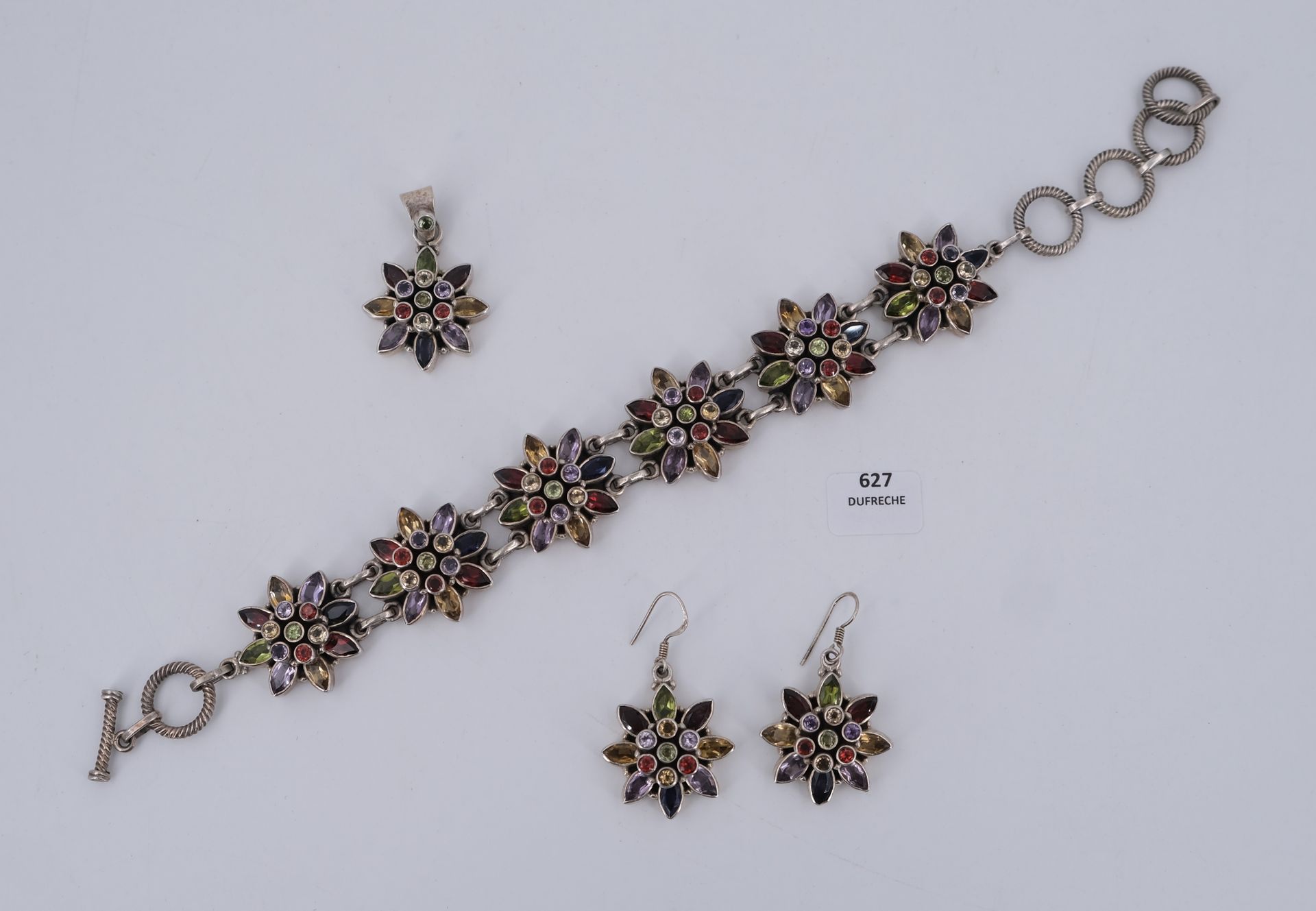 Null Blumen"-Set aus Silber und mehrfarbigen Steinen, bestehend aus einem Armban&hellip;