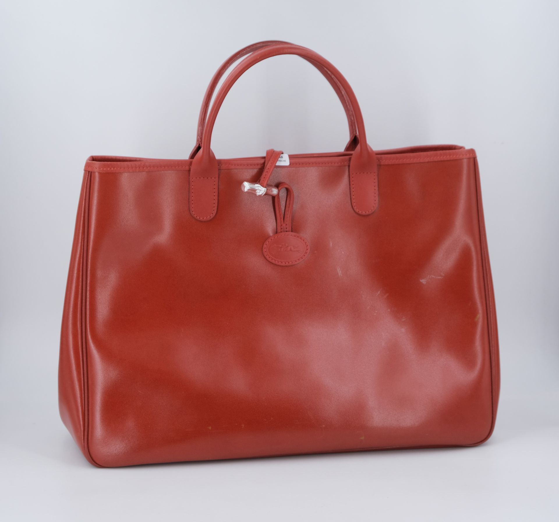 Null LONGCHAMP. Leather tote bag with metal bamboo clasp. 30 X 38 X 12 (wear).