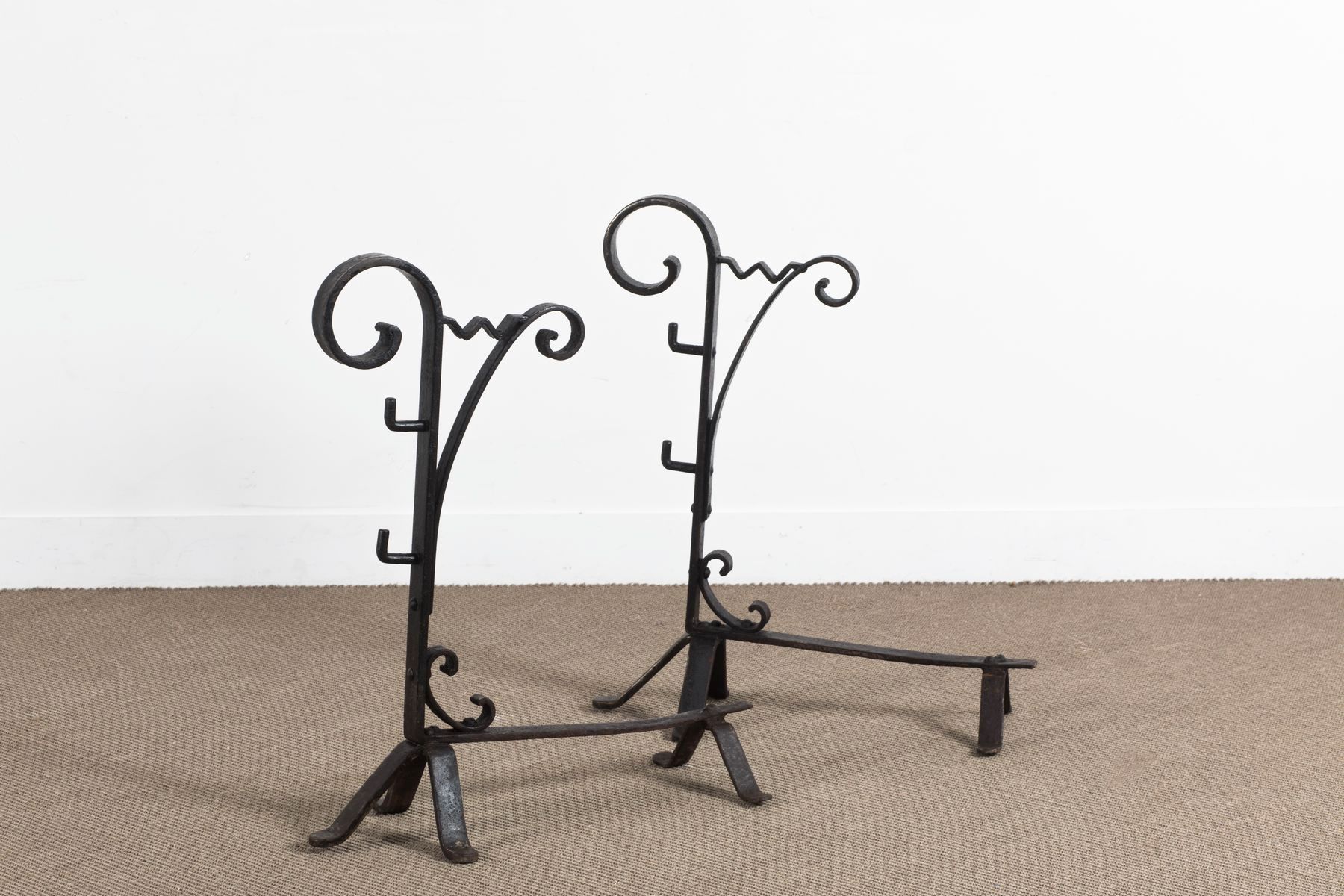 Null Circa 1950 

Pair of cast iron andirons with scroll decoration.