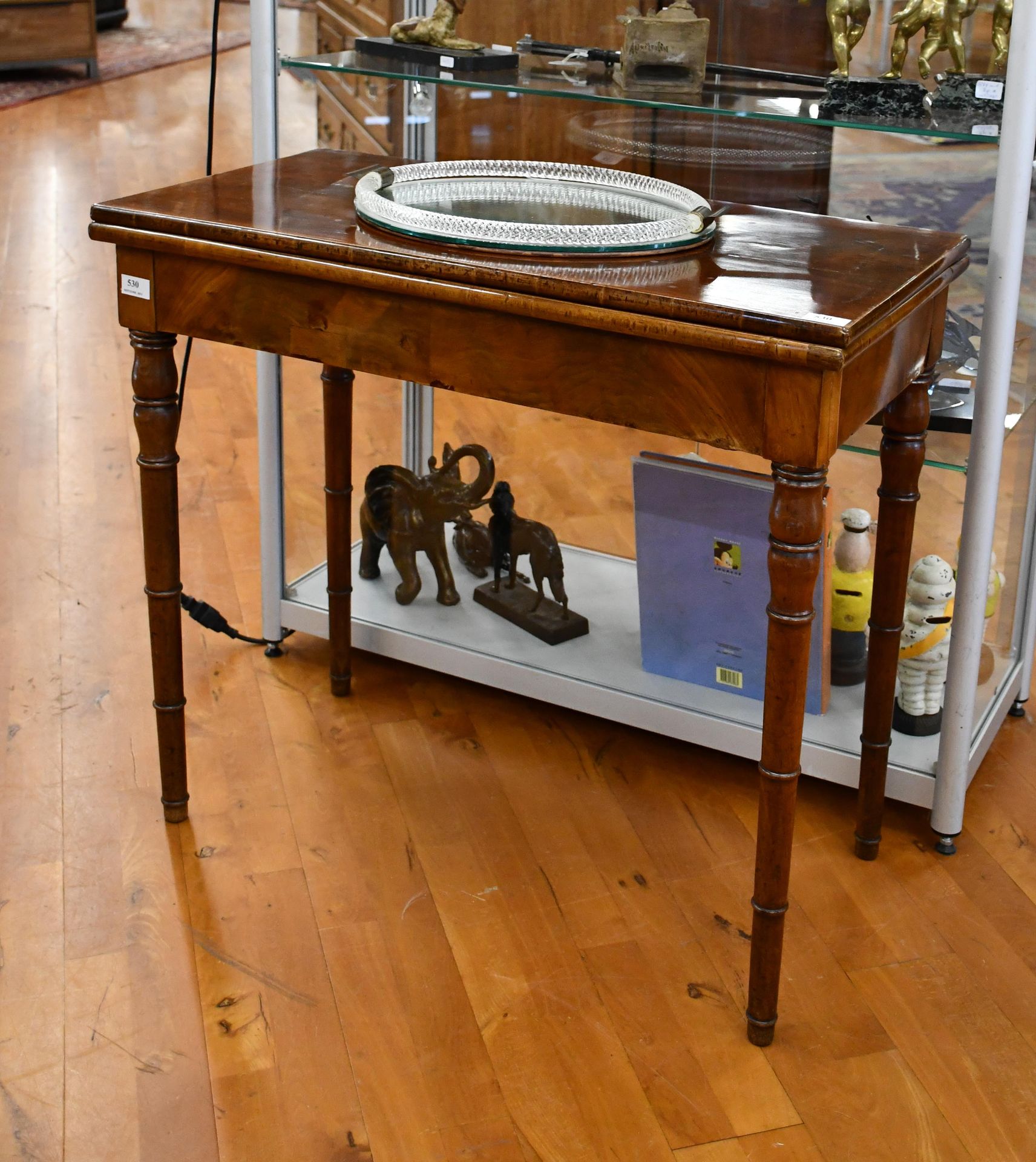 Null XIXth century console forming a game table, with turned legs