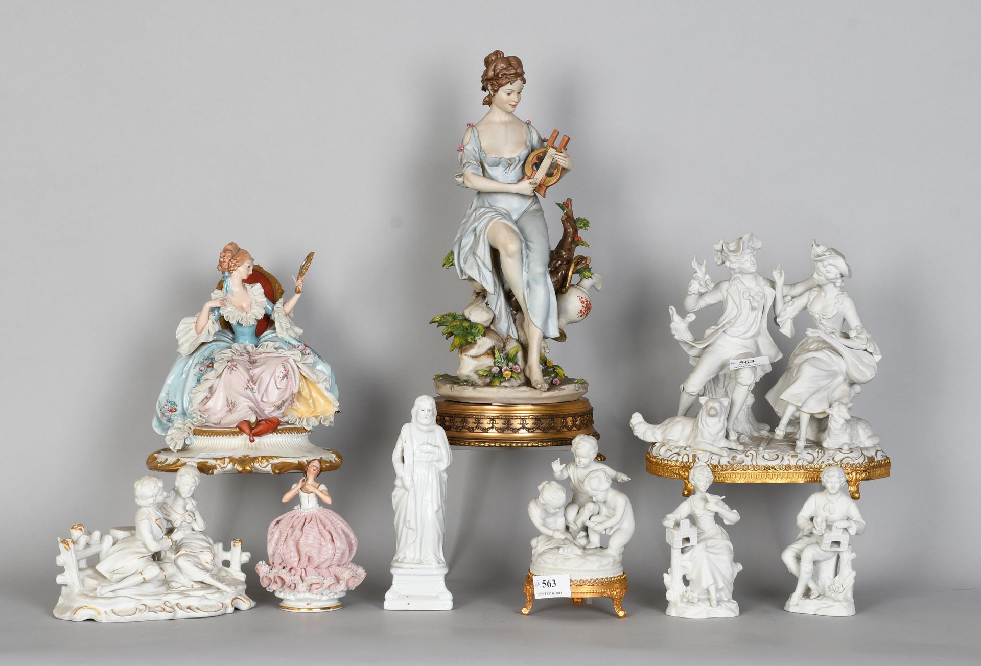 Null Set of polychrome porcelain and biscuit statues